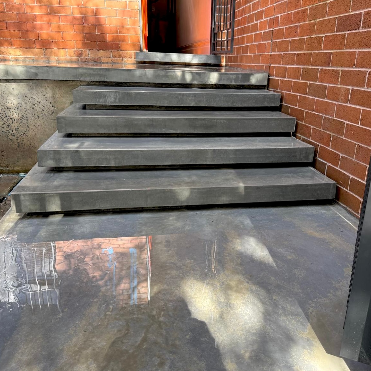 Burnished concrete — between trowel and polish.